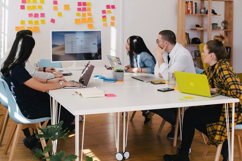 Clever Oak representatives reviewing campaign performance in a bright meeting room