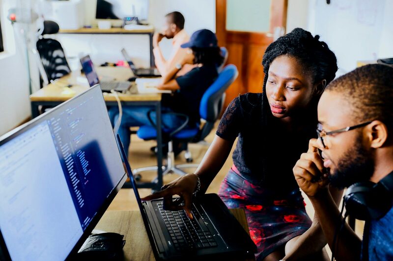 Colleagues reviewing campaign results together at a workstation